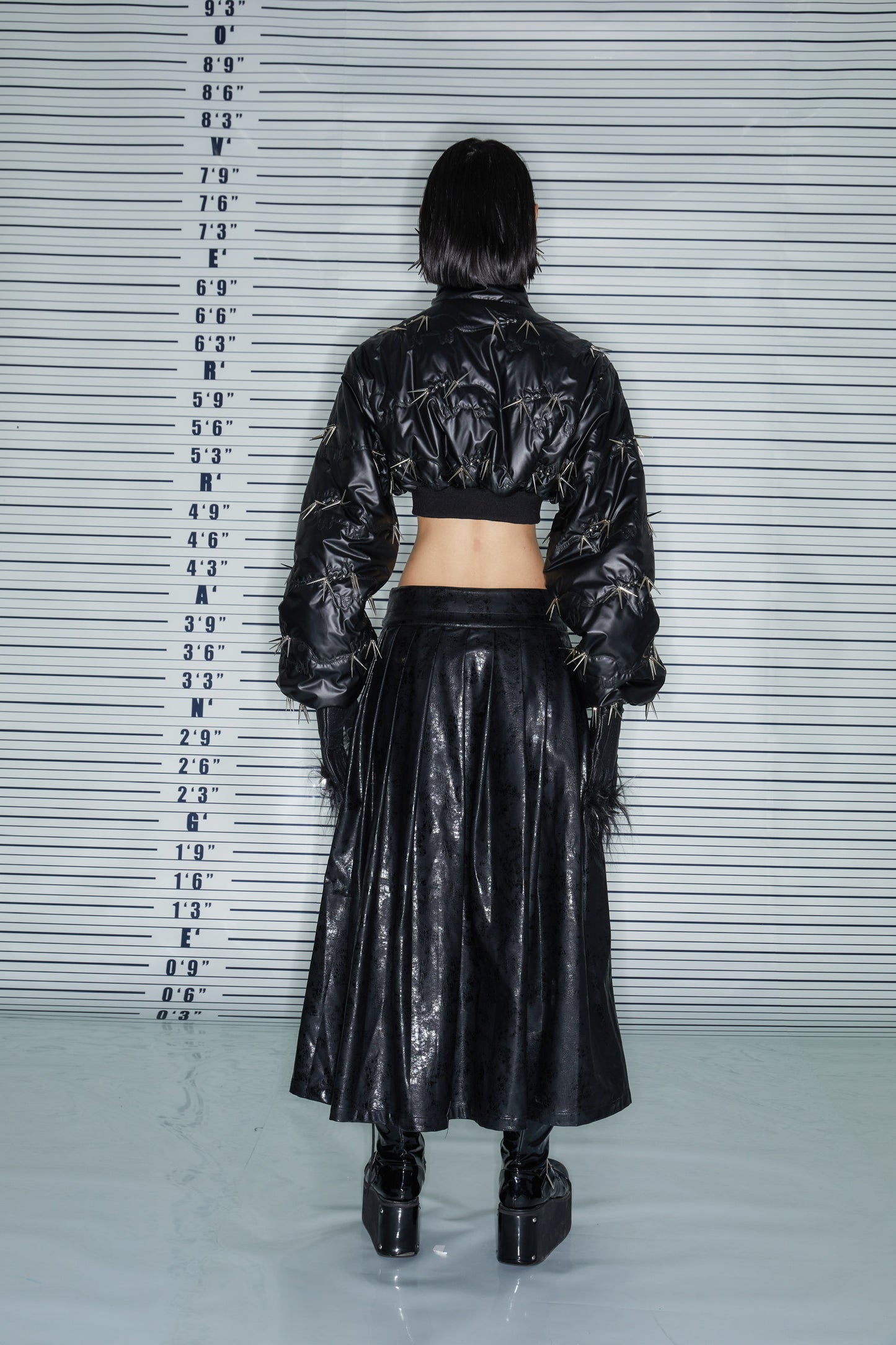 THE PLEATED LEATHER SKIRT